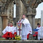 Bishop speaking in Cathedral in open air